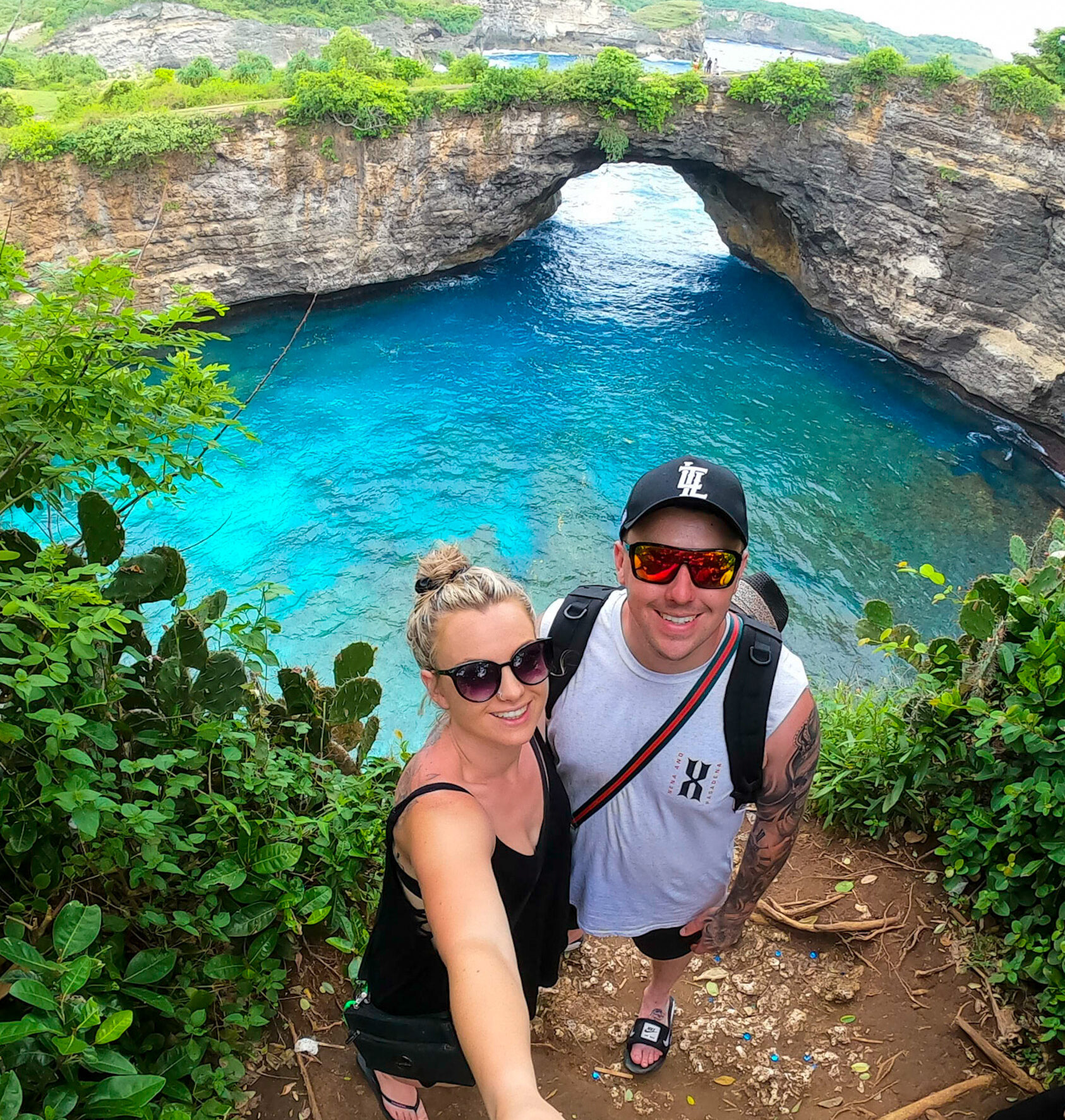 Experience the breathtaking beauty of Nusa Penida, Bali, with this captivating photo of Jayden and me standing against the backdrop of the bluest waters imaginable. The crystal-clear ocean and dramatic cliffs create a stunning panorama, showcasing the natural wonders of this tropical paradise. This moment captures our awe and excitement as we explore one of Bali's most picturesque destinations, highlighting the bond between us amidst the incredible scenery. It’s a treasured memory of our adventure, filled with wonder, joy, and the vibrant colours of nature.