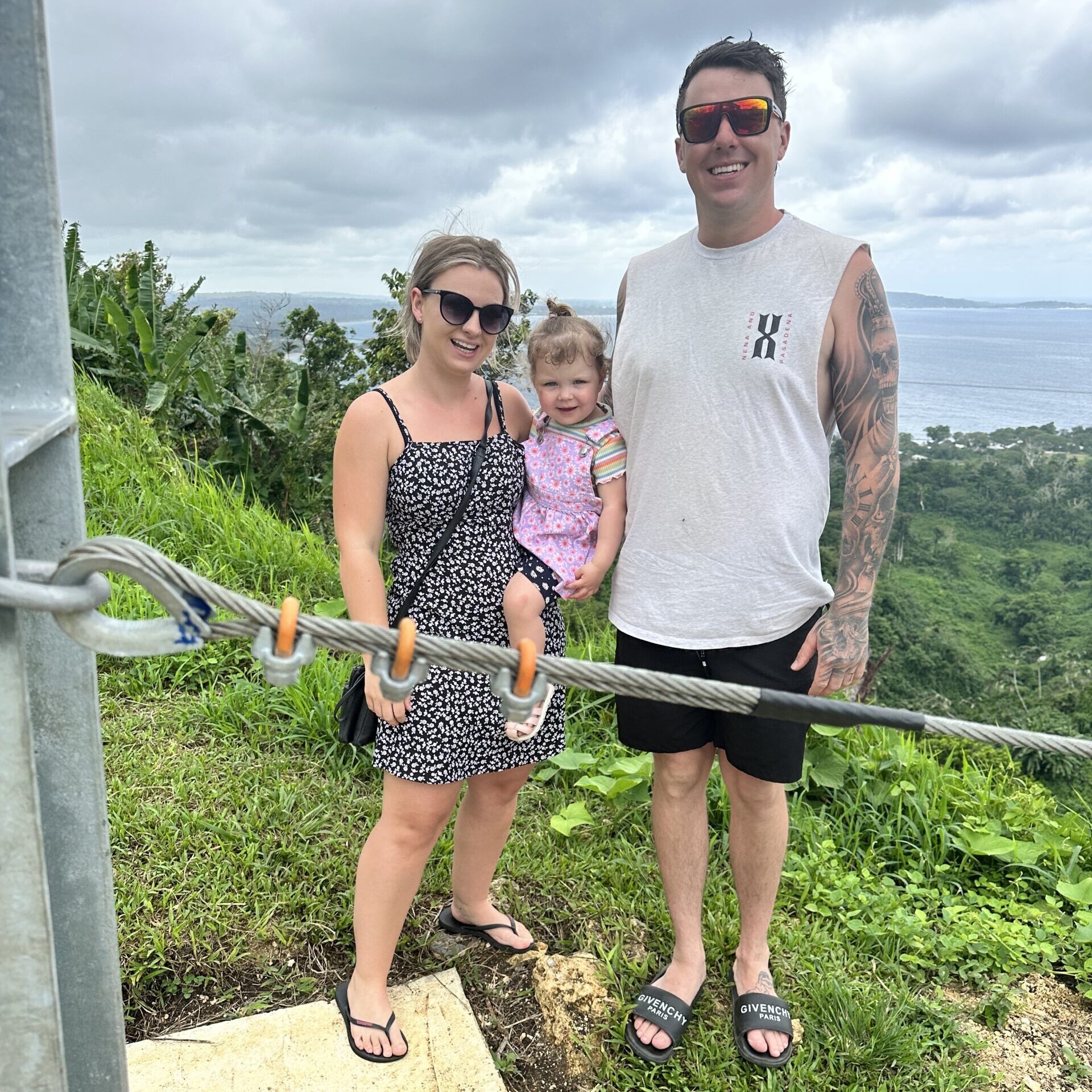 A family enjoying an exhilarating zip line experience in Vanuatu, surrounded by lush greenery and breathtaking views of the landscape. Lots of things to do in Vanuatu