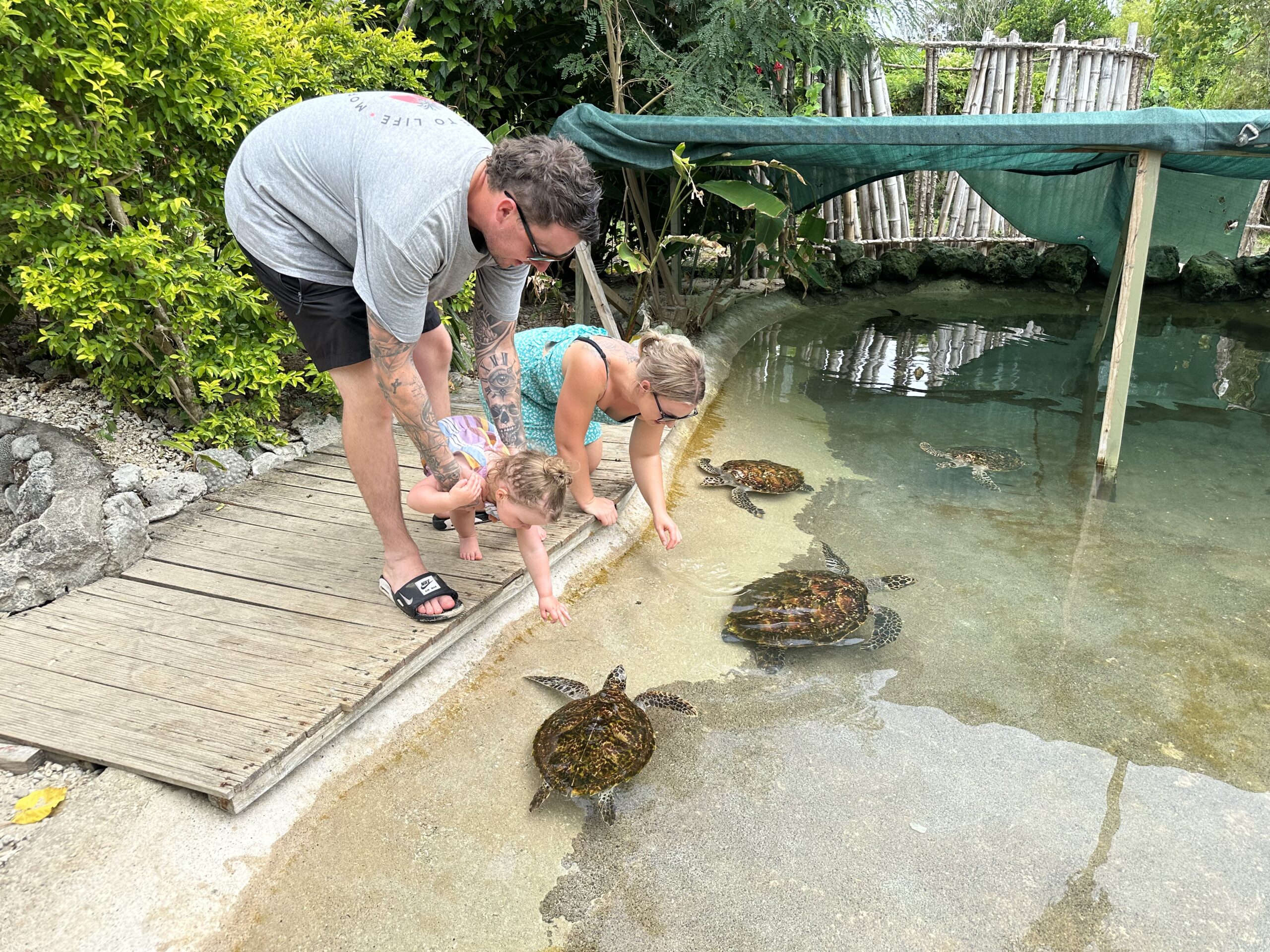 Tonia, Jayden, and Hailey savouring local cuisine together while traveling to Vanuatu.