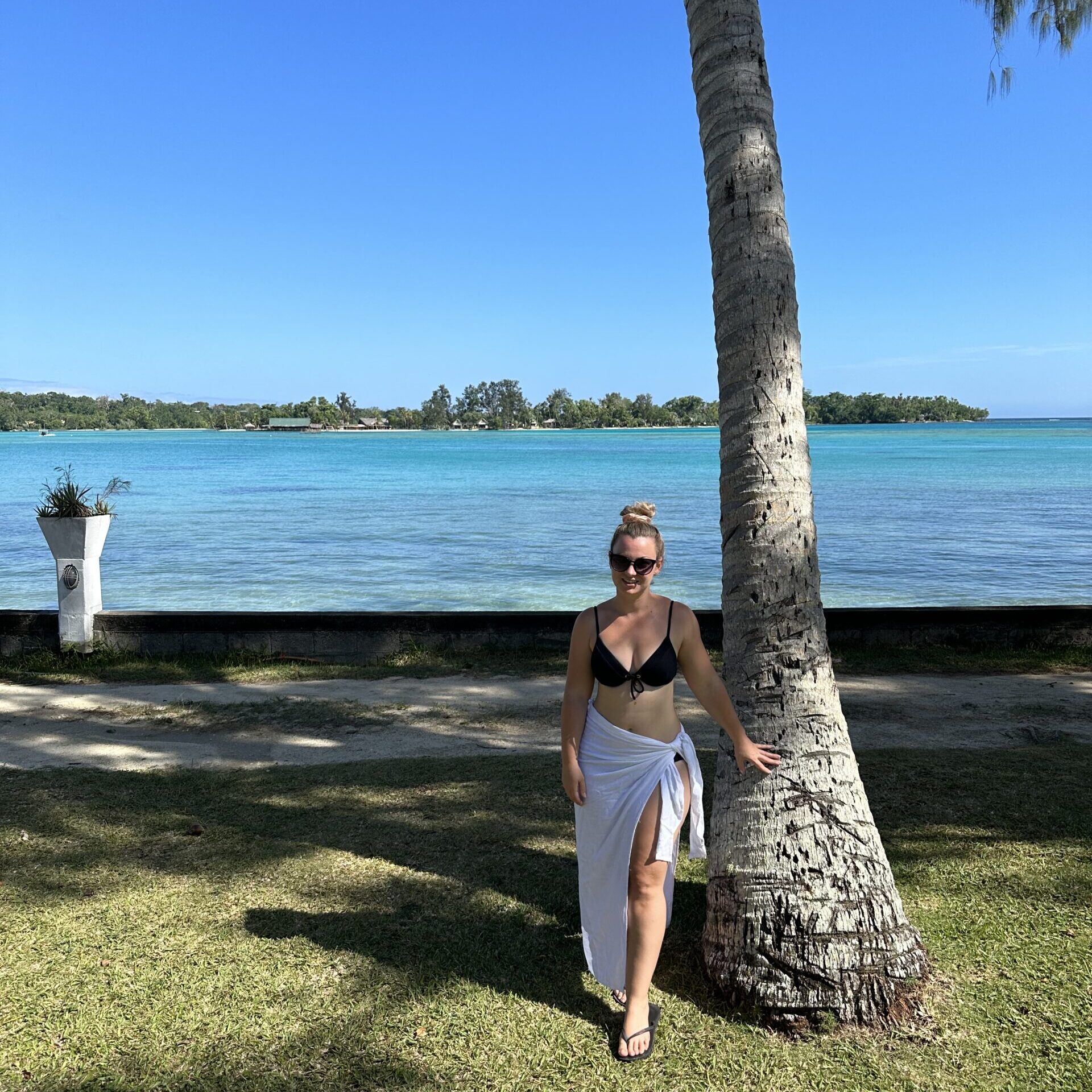 Tonia enjoying a sunny day by the beach in Vanuatu, capturing the essence of a relaxing island getaway.