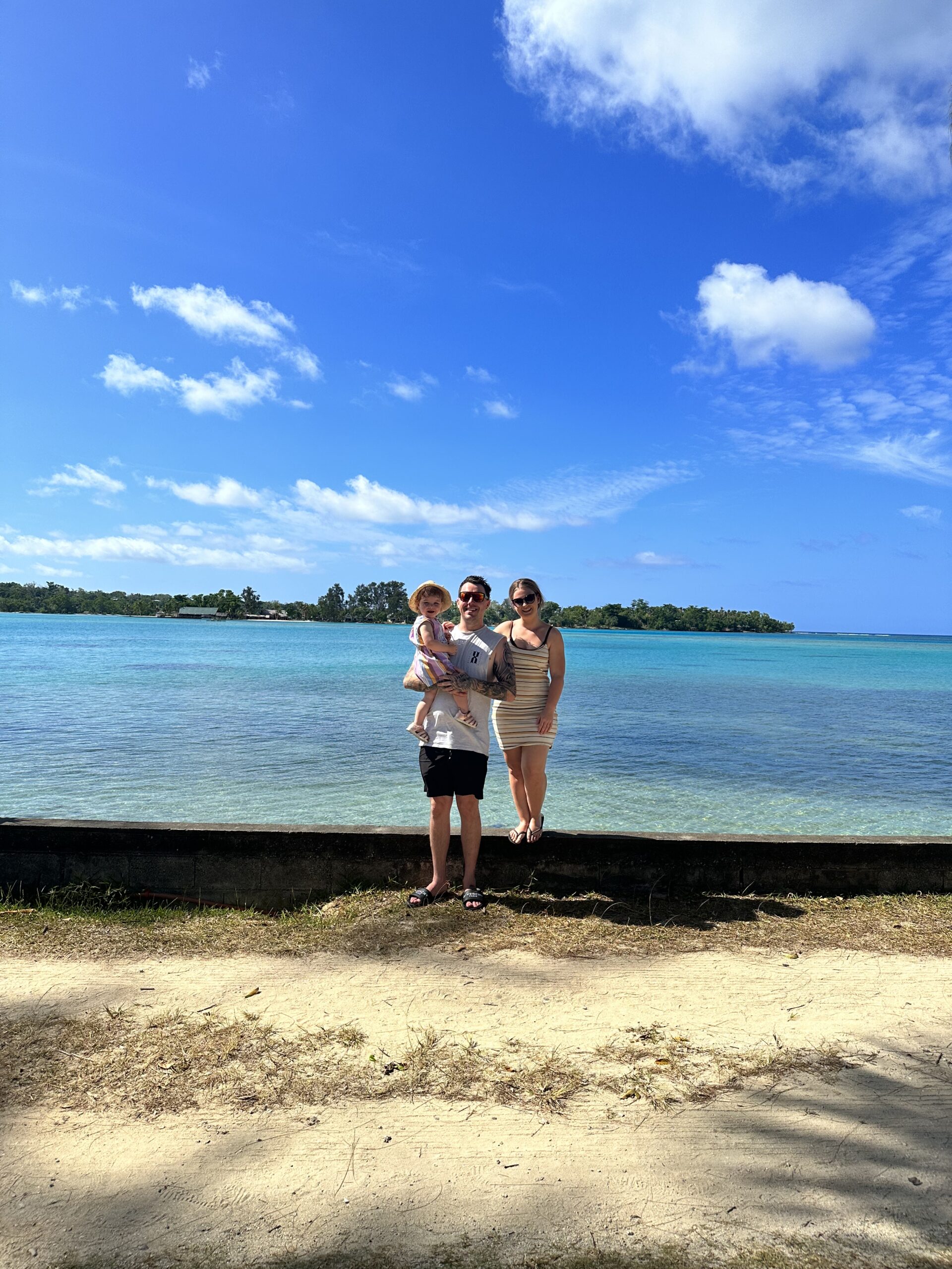 Tonia, Jayden, and Hailey relaxing by the pool during their trip to Vanuatu.
