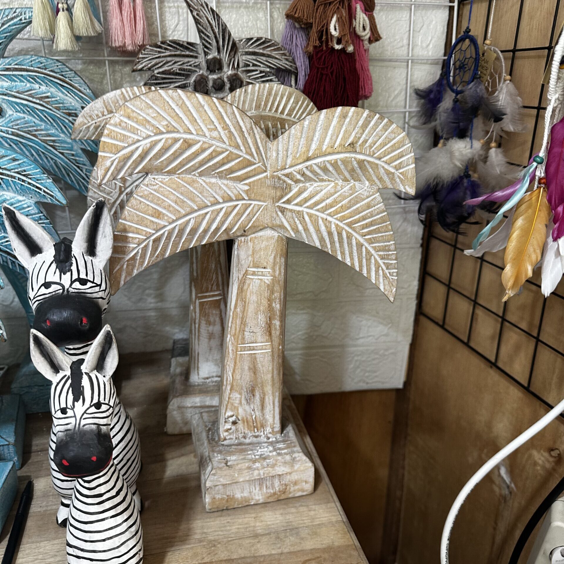 A vibrant display of various items for sale in a Bali shop, featuring clear price tags, showcasing unique local crafts and souvenirs without haggling.