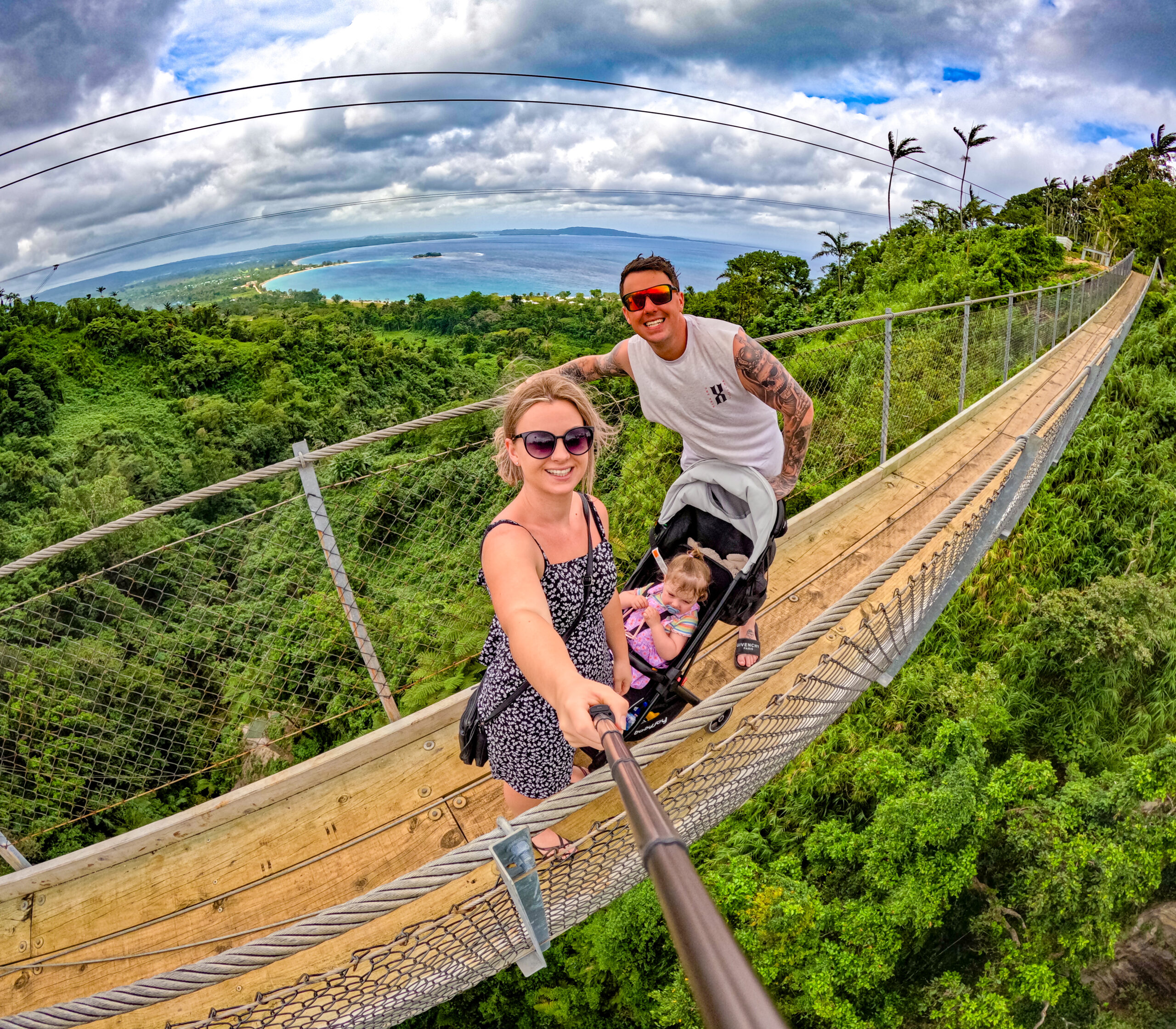 Tonia, Jayden, and Hailey enjoying a fun beach activity while traveling to Vanuatu.