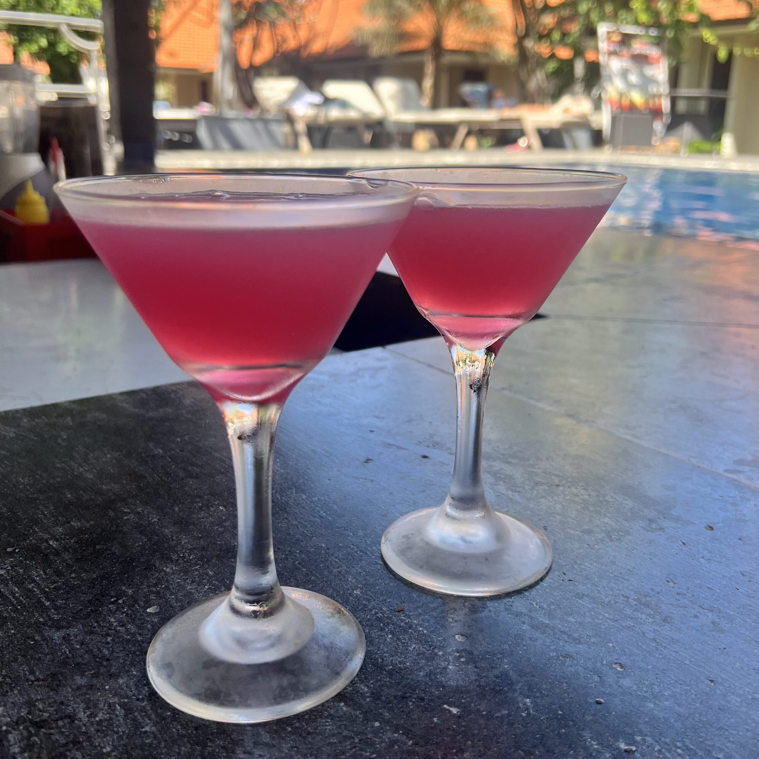 Two colorful cocktails, bubble gum and so safe, served at New Hotel Resort in Bali, showcasing essential Bali travel tips for a delightful experience.