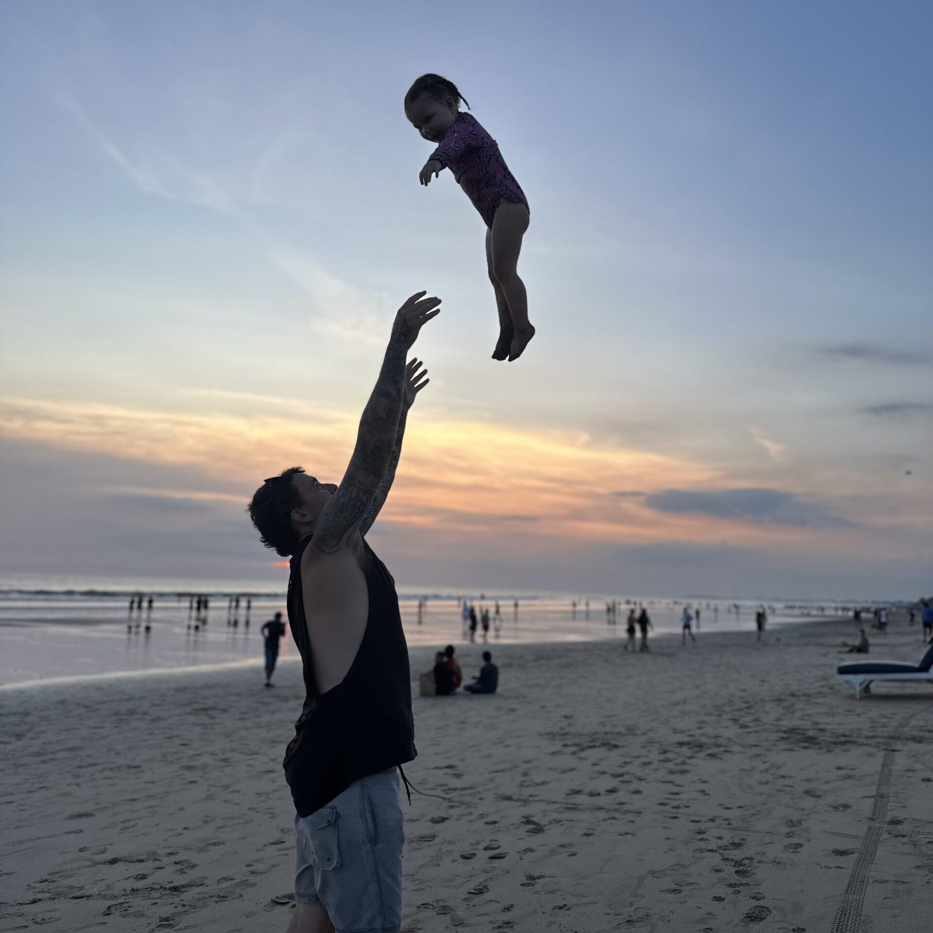 Experience the thrill of our Bali adventure with this exhilarating photo of Jayden playfully throwing Hailey up in the air on the beautiful beaches. This joyful moment captures their bond and the carefree spirit of childhood as they enjoyed the sun, sand, and surf. It’s a vibrant reminder of the laughter and happiness we shared during our trip, celebrating the simple joys of family time in the stunning backdrop of Bali’s coastline.